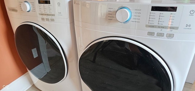 laundry room featuring washing machine and clothes dryer