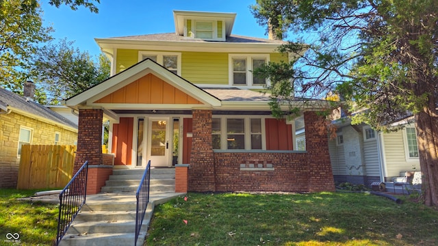 bungalow-style house with a front yard