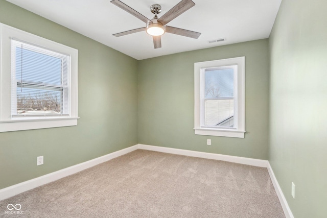 carpeted empty room with ceiling fan