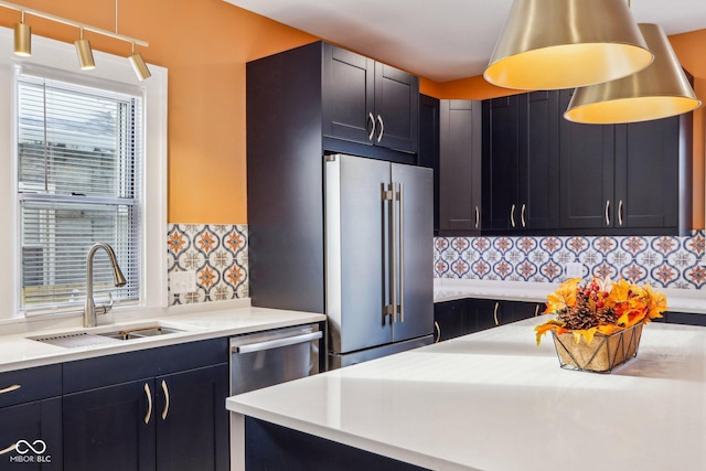 kitchen with stainless steel appliances, tasteful backsplash, and sink