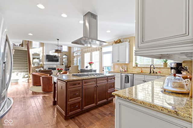 kitchen featuring a center island, stainless steel appliances, island exhaust hood, and dark wood-type flooring