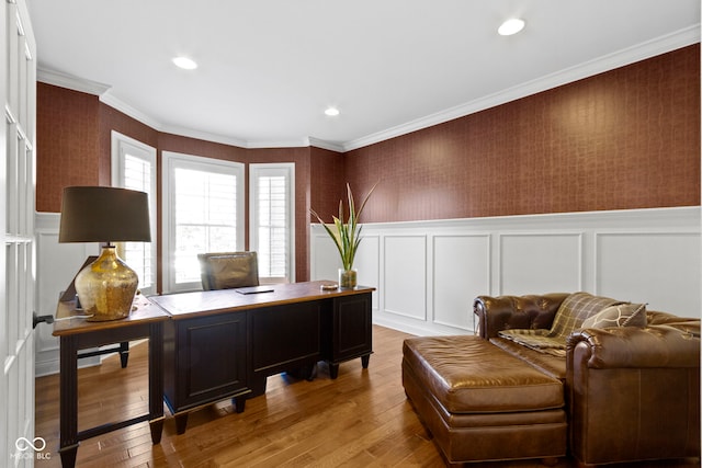 office space featuring light wood-type flooring and ornamental molding