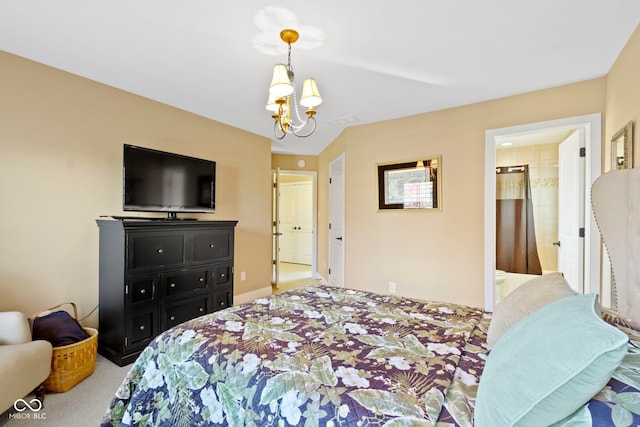 bedroom featuring ensuite bath, light colored carpet, and a chandelier