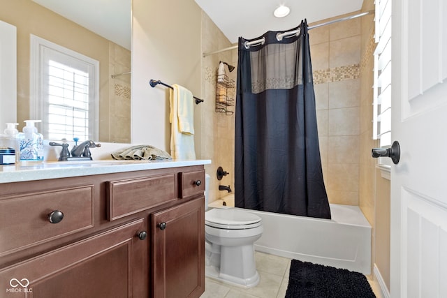 full bathroom featuring tile patterned floors, vanity, toilet, and shower / bath combo with shower curtain