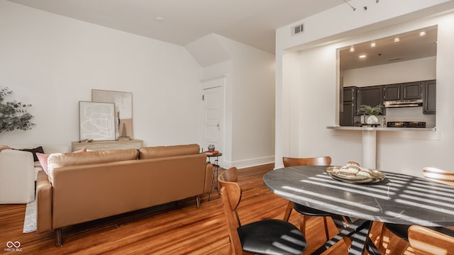 dining room with dark hardwood / wood-style flooring