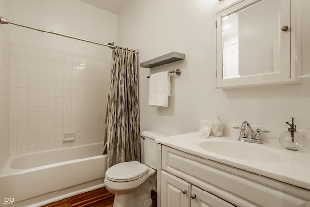 full bathroom featuring vanity, shower / bath combo with shower curtain, toilet, and wood-type flooring