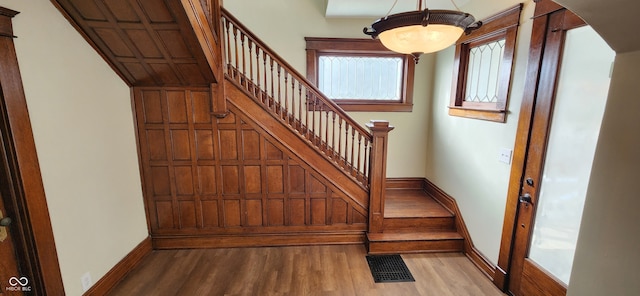 stairs with wood-type flooring