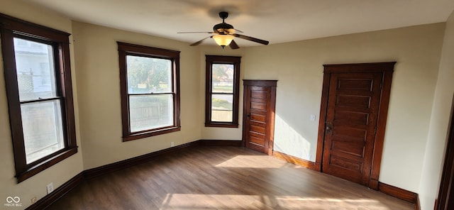 spare room with ceiling fan and hardwood / wood-style flooring