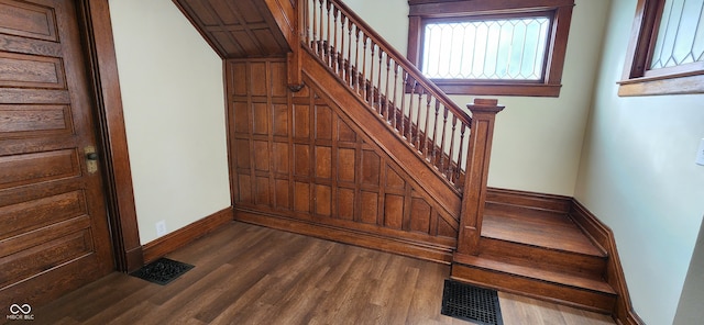 staircase featuring hardwood / wood-style flooring