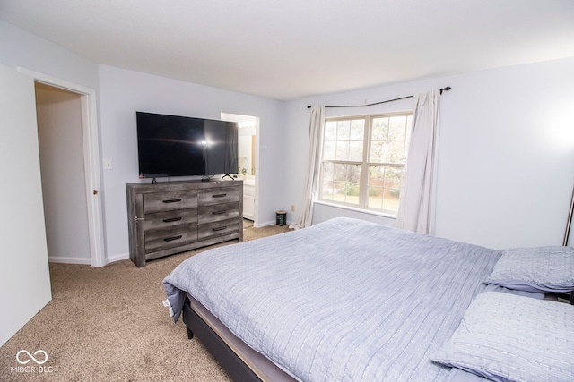 bedroom with light colored carpet