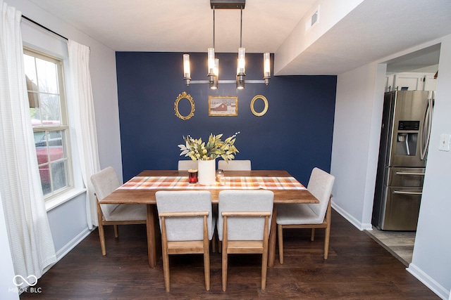 dining area featuring dark hardwood / wood-style flooring