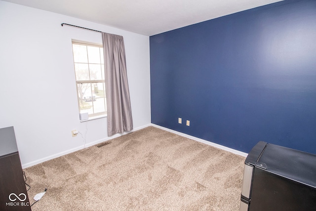 empty room featuring carpet floors