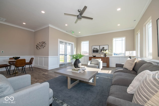 living room with hardwood / wood-style flooring, ceiling fan, crown molding, and french doors