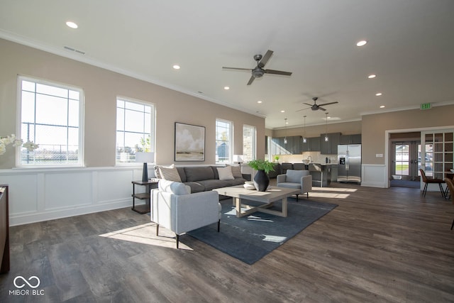 living room with french doors, crown molding, and dark hardwood / wood-style floors