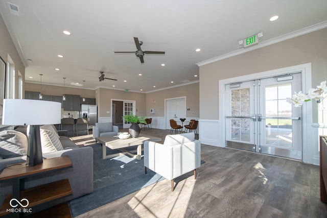 living room featuring dark wood-type flooring, crown molding, french doors, and ceiling fan