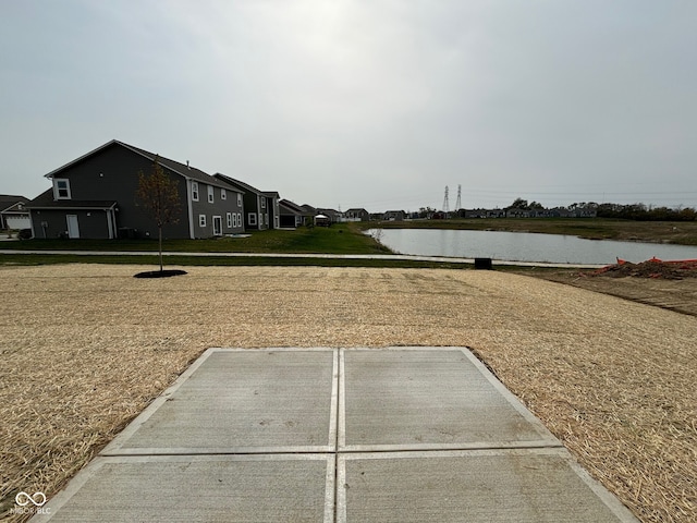 view of parking with a water view