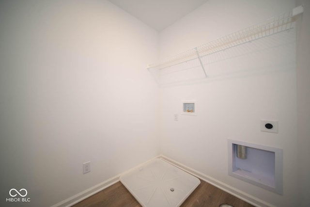 washroom featuring hardwood / wood-style flooring, washer hookup, and hookup for an electric dryer