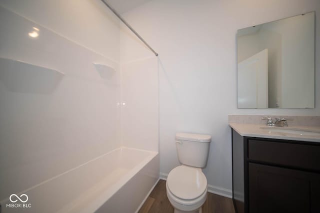 full bathroom featuring shower / bathtub combination, wood-type flooring, toilet, and vanity