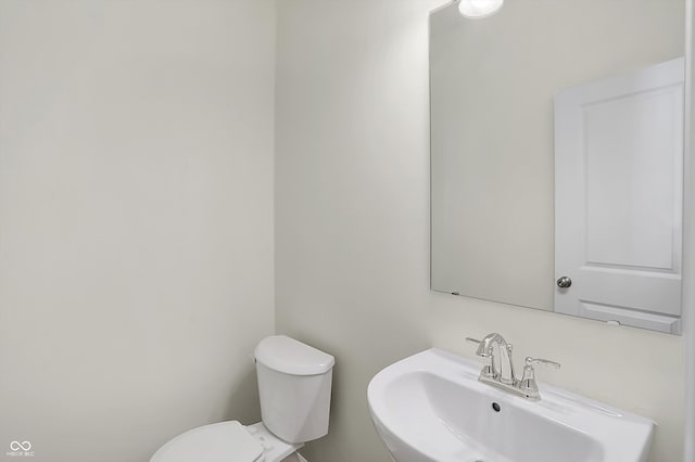 bathroom with toilet and sink