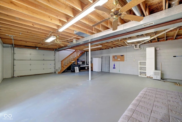 9300 Derrett Rd, Unionville, IN 47468 - garage with freestanding refrigerator and a ceiling fan