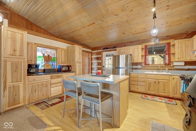 9300 Derrett Rd, Unionville, IN 47468 - kitchen featuring light brown cabinets, black microwave, lofted ceiling, light wood-style flooring, and wooden ceiling