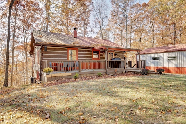 9300 Derrett Rd, Unionville, IN 47468 - view of front facade with a chimney, a front lawn, and a metal roof