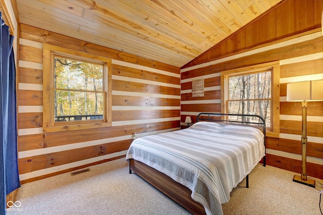 9300 Derrett Rd, Unionville, IN 47468 - bedroom featuring lofted ceiling, wood walls, wooden ceiling, and carpet