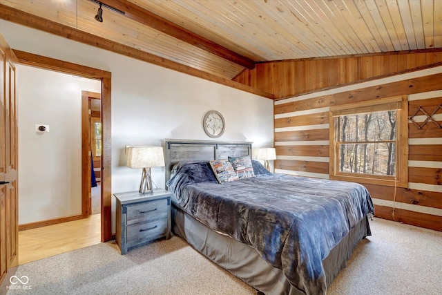 9300 Derrett Rd, Unionville, IN 47468 - bedroom with light carpet, wood walls, and wood ceiling