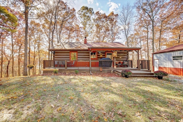 9300 Derrett Rd, Unionville, IN 47468 - rear view of house featuring a yard, a metal roof, a chimney, a deck, and log exterior