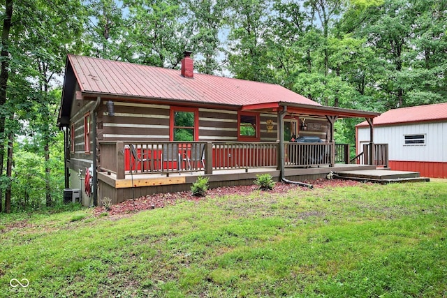 9300 Derrett Rd, Unionville, IN 47468 - back of property with a chimney, a metal roof, a lawn, and a deck