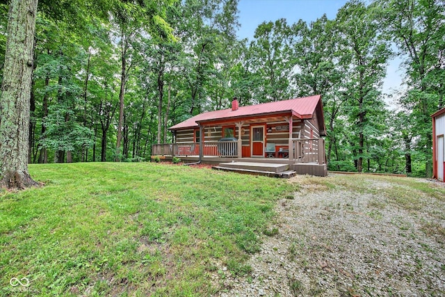 9300 Derrett Rd, Unionville, IN 47468 - view of front facade featuring a chimney, a front yard, and a metal roof