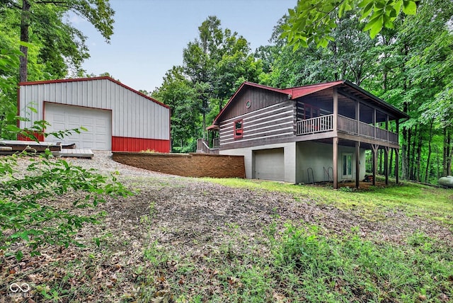 9300 Derrett Rd, Unionville, IN 47468 - view of side of property featuring dirt driveway and a garage