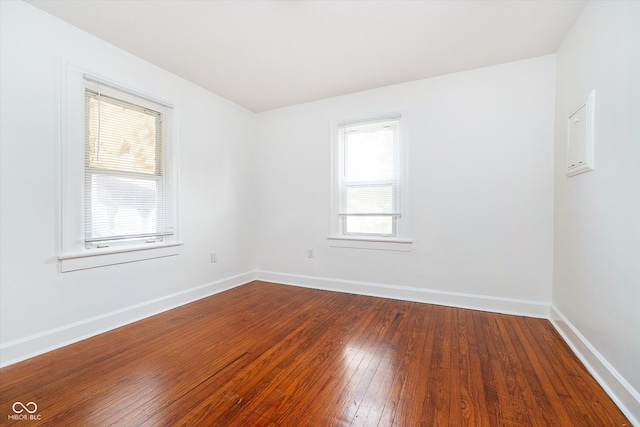 spare room with wood-type flooring