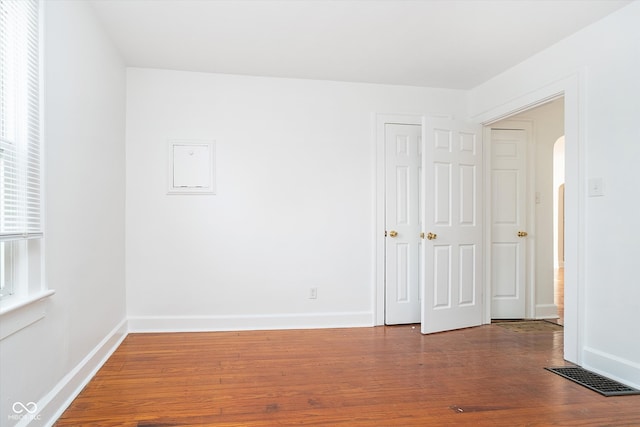 spare room featuring hardwood / wood-style floors