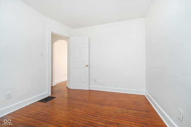 unfurnished room with hardwood / wood-style floors