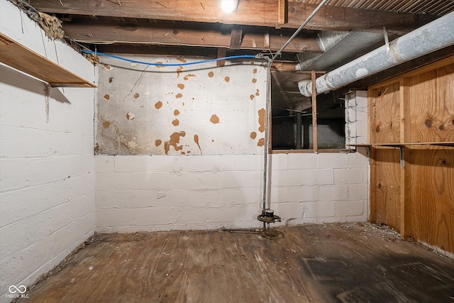 basement with hardwood / wood-style flooring