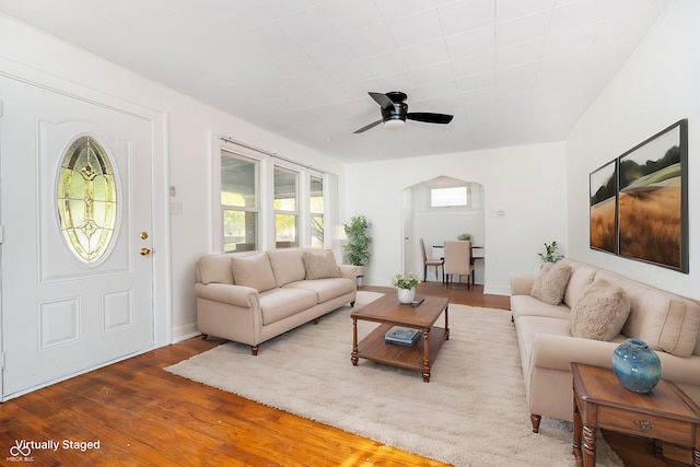 living room featuring hardwood / wood-style flooring and ceiling fan