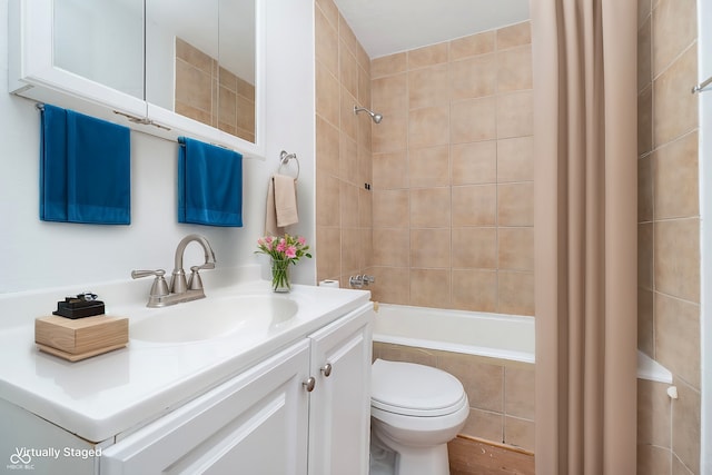 full bathroom with toilet, shower / tub combo, and vanity