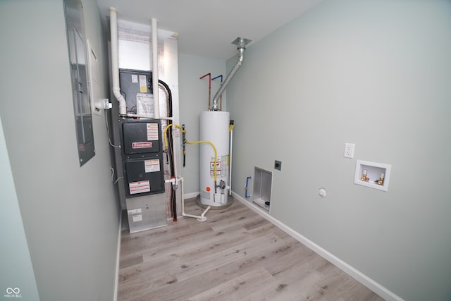 utility room featuring water heater