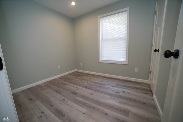 unfurnished room featuring light wood-type flooring