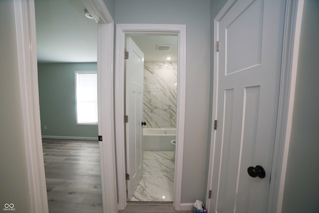 hallway featuring light hardwood / wood-style flooring