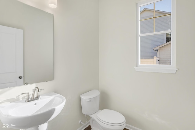 bathroom with toilet and sink