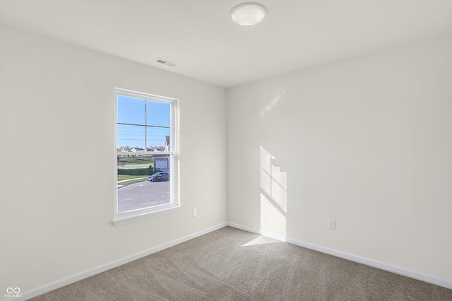 unfurnished room with carpet flooring