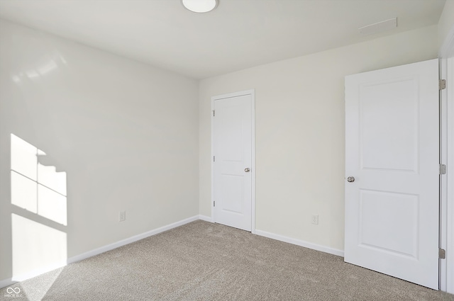 empty room featuring carpet flooring