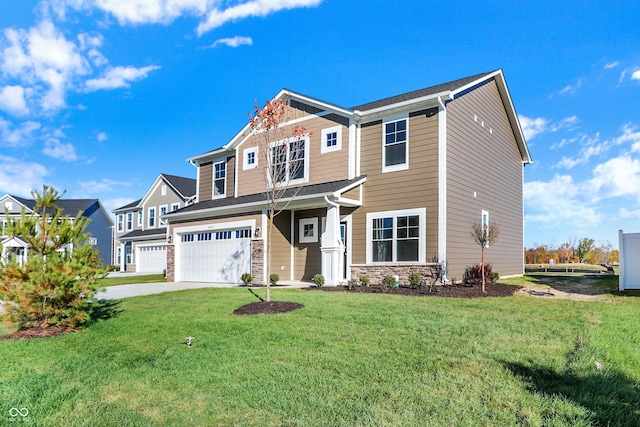 view of front of home featuring a front lawn and a garage