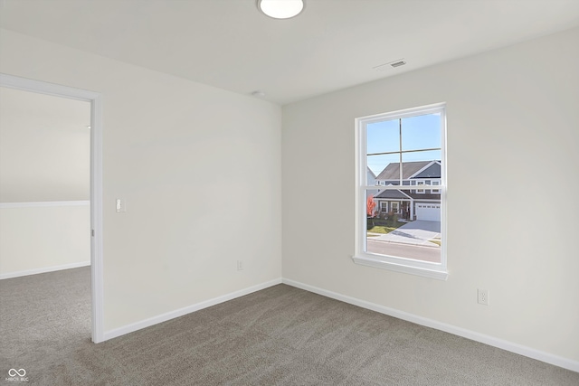 unfurnished room with carpet flooring