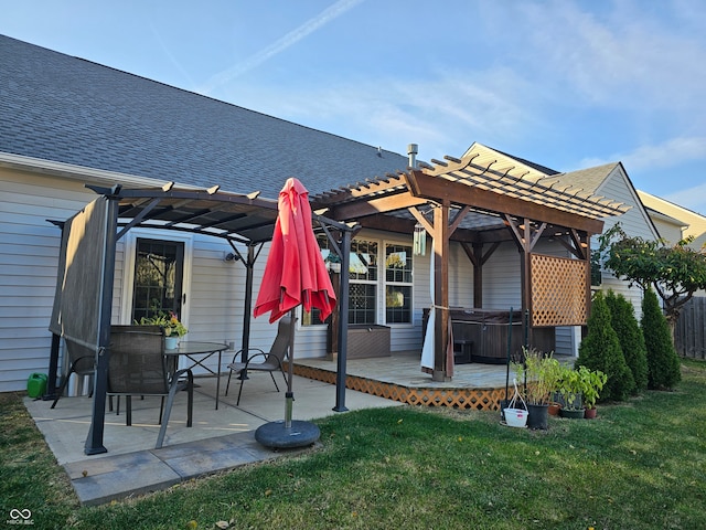 back of property featuring a yard, a pergola, a hot tub, and a patio area