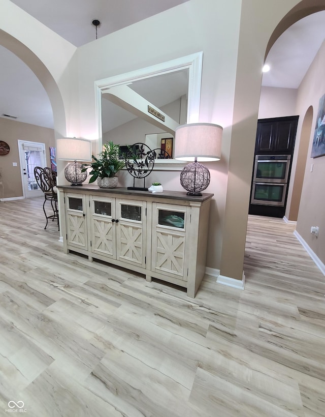 interior space featuring hardwood / wood-style flooring and double oven