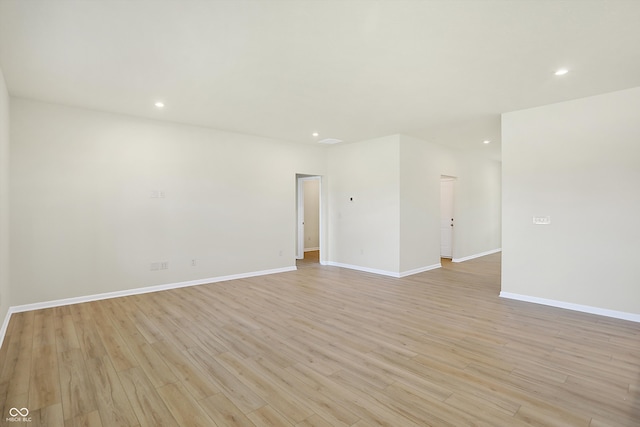 empty room with light hardwood / wood-style floors