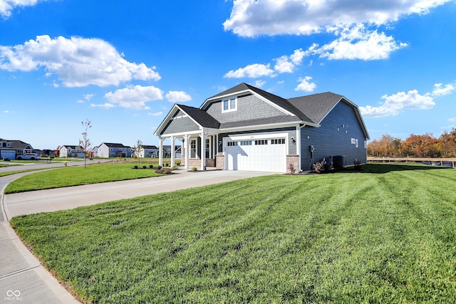 view of front of house with a front yard and a garage